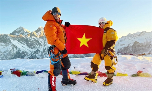 Mountaineer Nguyen Thanh Binh (right) and Phan Thanh Nhien on top of Ama Dablam on November 9. (Photo courtesy of Binh)