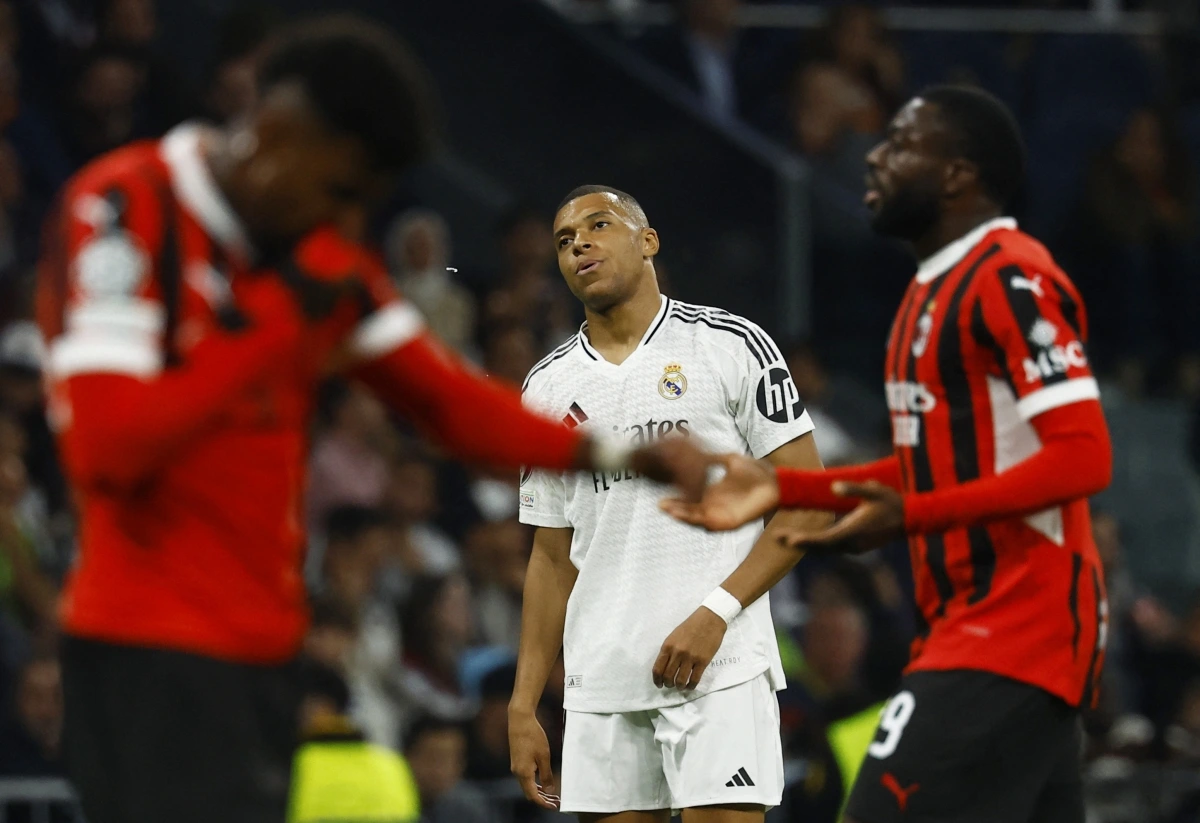 Real Madrid thua tâm phục khẩu phục trước AC Milan (Ảnh: Reuters).