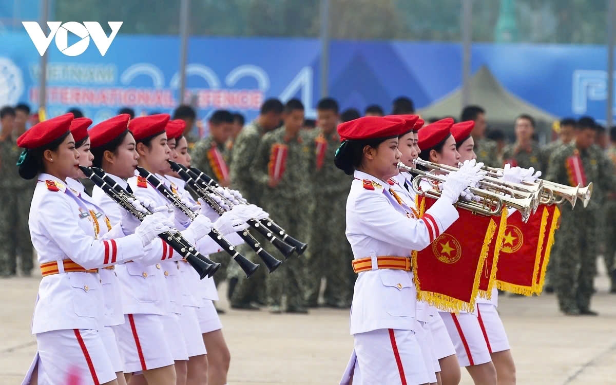 While the fighting jets are performing in the sky, ground forces march and show spectacular displays.