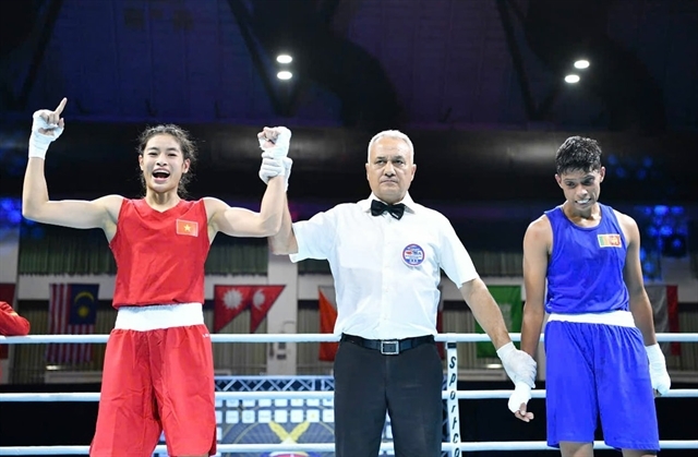 Ngo Ngoc Linh Chi (red jersey) wins a silver medal at the 2024 Asian Boxing Championship. (Photo courtesy of Nhu Cuong)