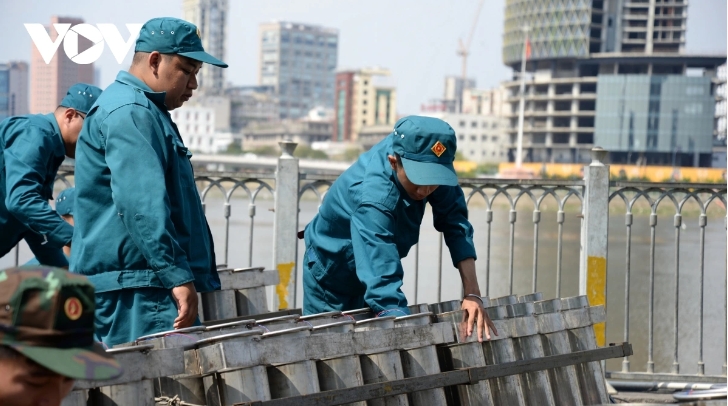 Soldiers are present in Thu Duc City as they prepare for a firework show on New Year's Eve.