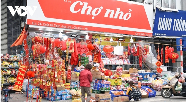 Traders at the market explain that there are fewer buyers today as perhaps they have already done their shopping for Tet.