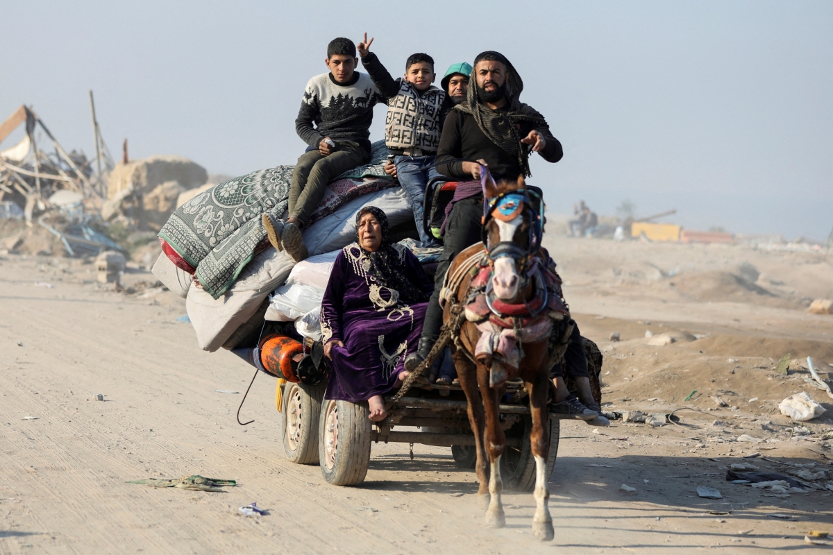 Người dân khu vực phía Bắc dải Gaza trở về nhà hôm 29/1. Nguồn: Reuters
