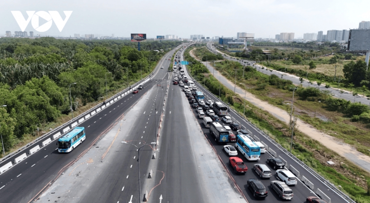 Vehicles line up as they form a long queue on the expressway.