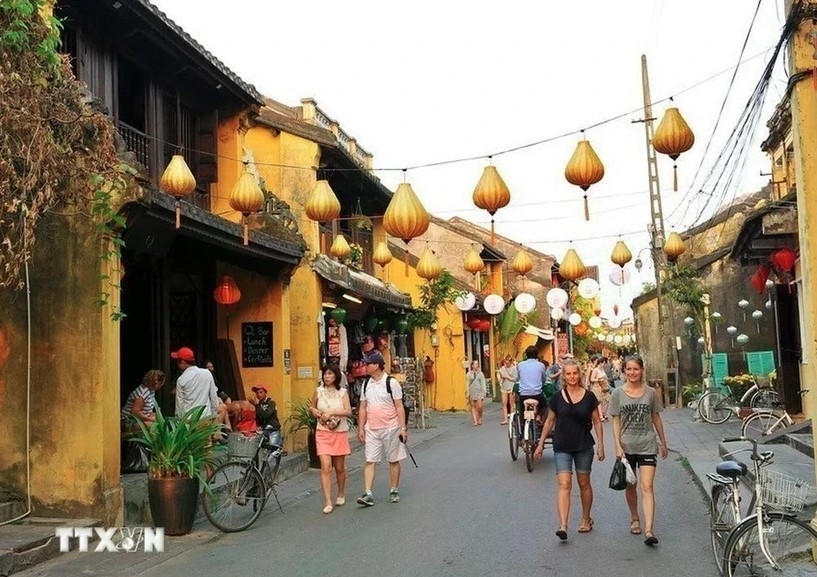 Domestic and foreign tourists visit Hoi An ancient town in the central province of Quang Nam.