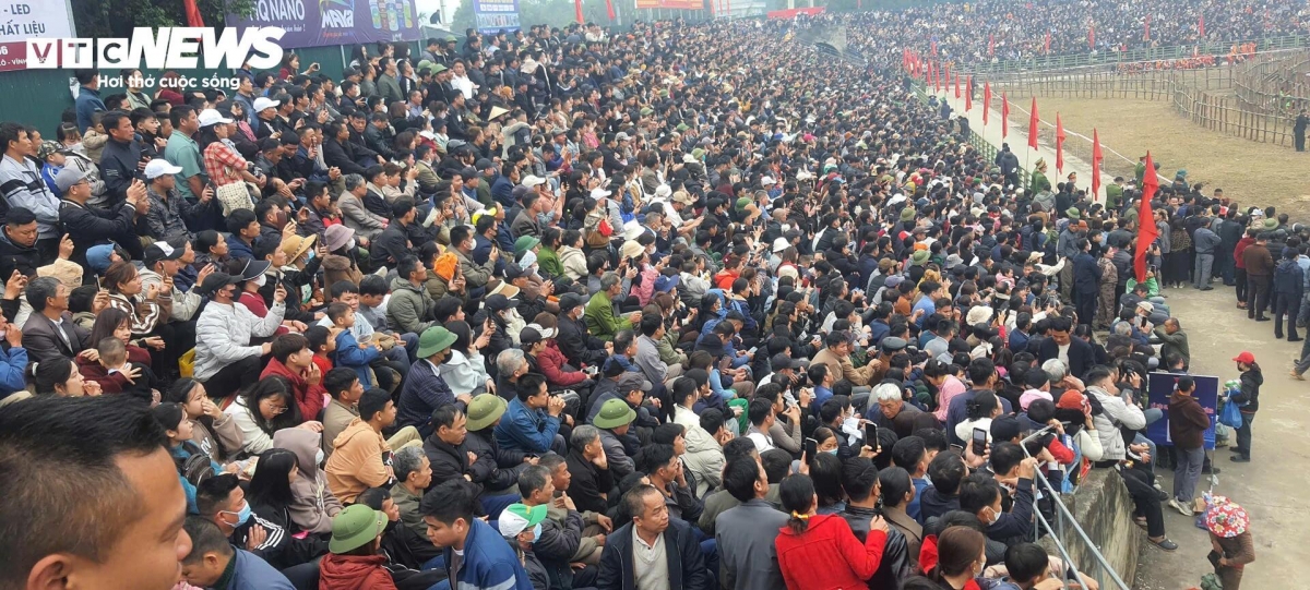 The stadium is packed with tens of thousands of eager spectators.