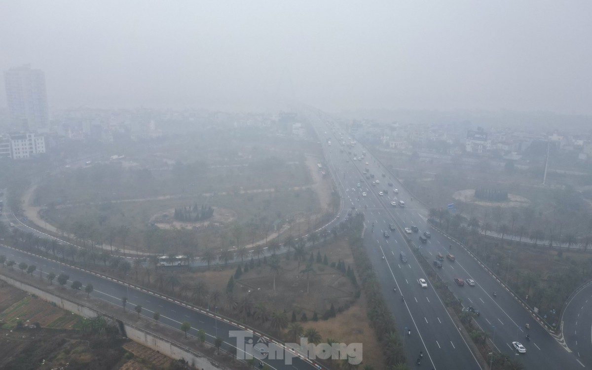 Nhat Tan bridge almost disappears amidst the dense fog