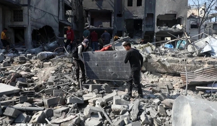 Các tòa nhà bị phá hủy sau cuộc không kích của Israel tại Gaza, ngày 18/3/2025 (Ảnh: THX/TTXVN)