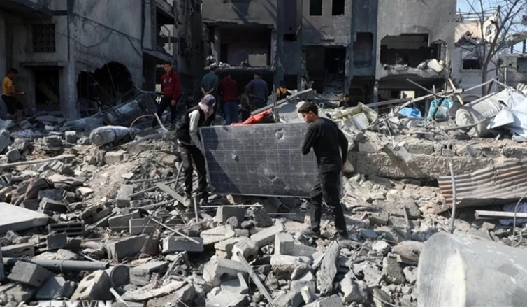 Các tòa nhà bị phá hủy sau cuộc không kích của Israel tại Gaza, ngày 18/3/2025 (Ảnh: THX/TTXVN)