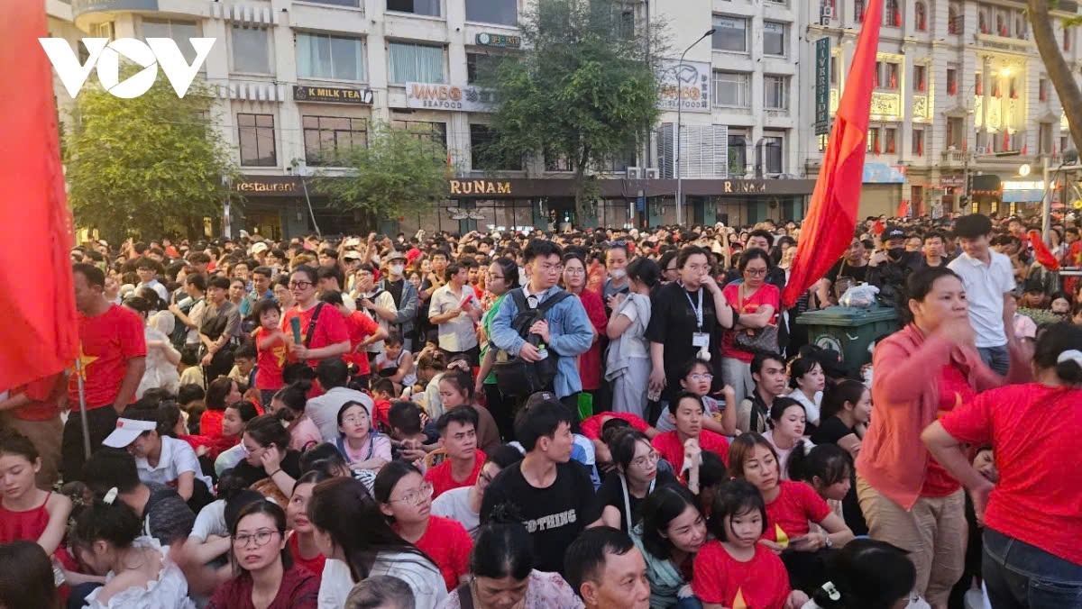 Thousands of people gather the night before to secure good spots for watching the military parade.