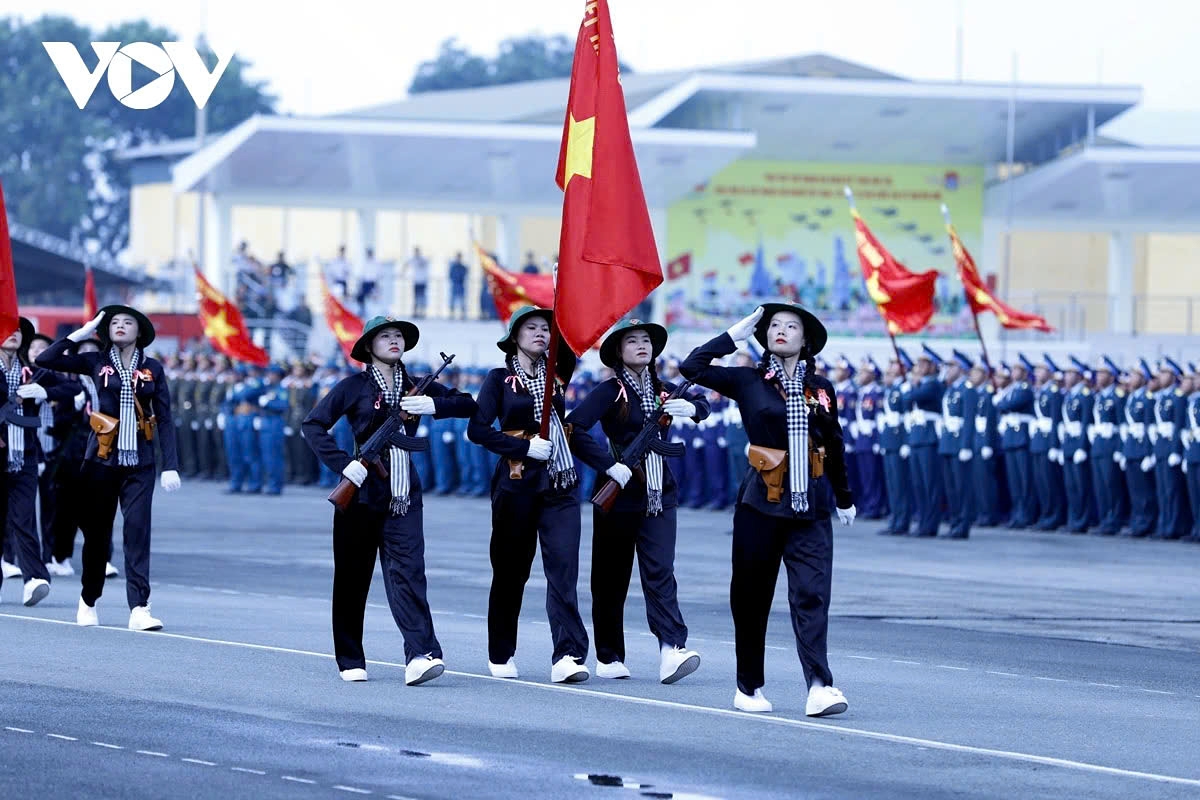 The Southern Female Guerrilla formation marches past the grandstand.