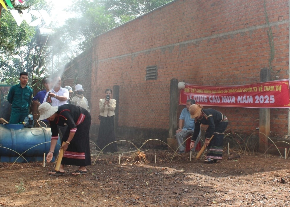 Locals perform a ritual of sowing seeds.