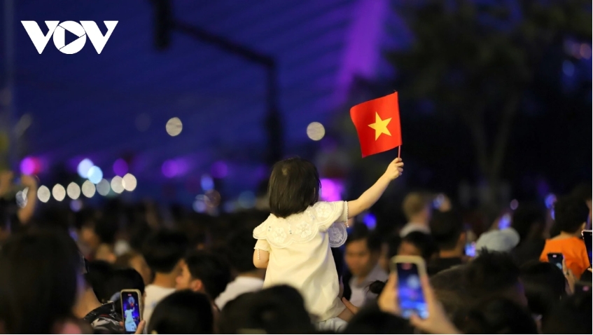 A little girl eagerly awaits the fireworks show