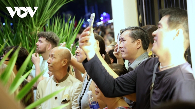 Locals and tourists delight in capturing the fireworks