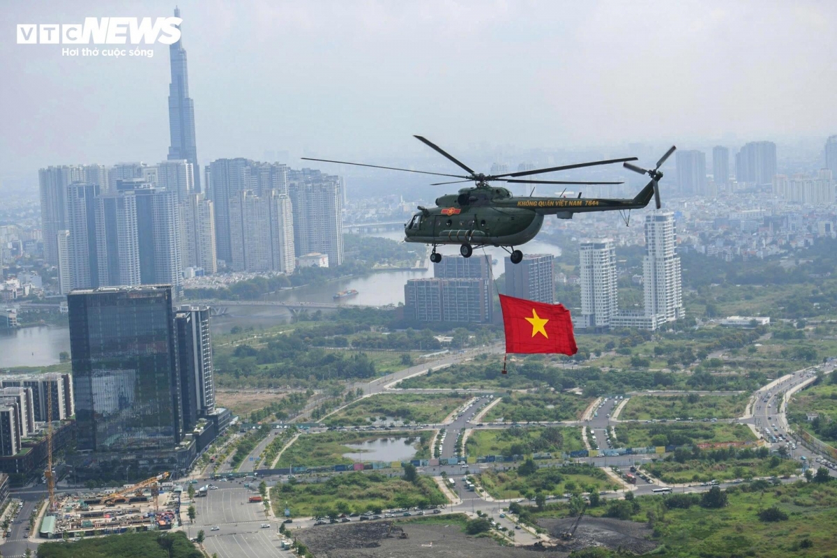 Military aircraft bear national flags as part of the event.