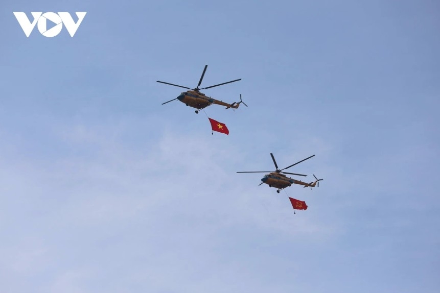 Helicopter raises flags over Bach Dang Wharf area