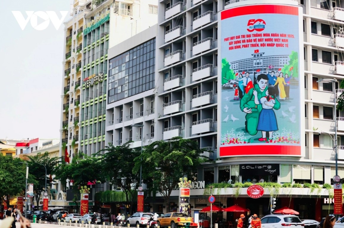 Major streets such as Nguyen Hue, Le Loi, Nguyen Du, and Truong Chinh are filled with national flags, posters, billboards, and slogans.