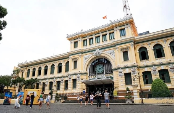 Tourists visit Sai Gon Central Post Office in Ho Chi Minh City downtown