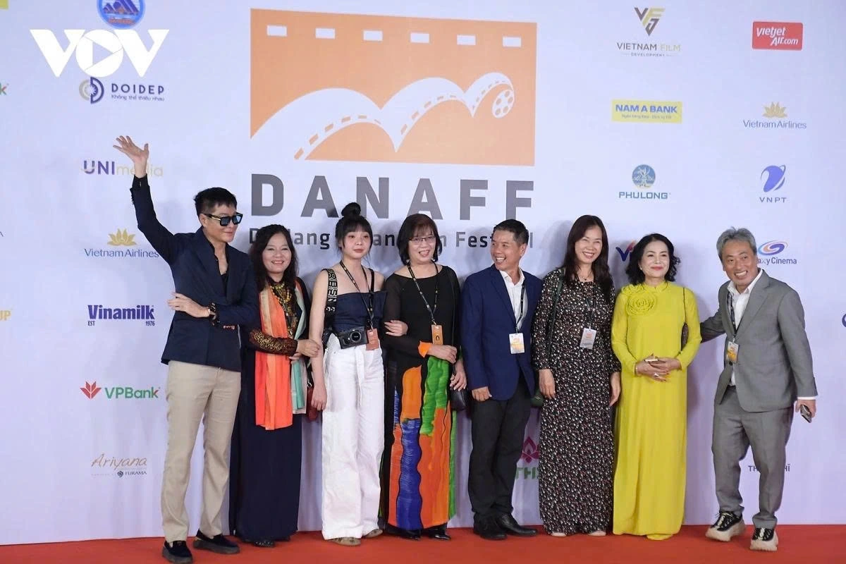 Director Nguyen Quang Dung (far right) arrives with the Friendzone Love film crew.