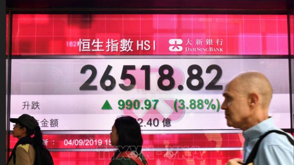Chứng khoán châu Á tăng, đồng USD suy yếu sau khi Mỹ tăng thuế nhôm, thép. Ảnh: AFP/TTXVN