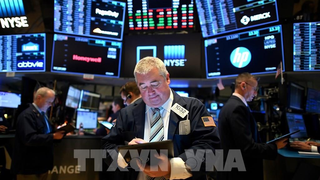 Giao dịch viên tại Sàn giao dịch chứng khoán New York, Mỹ - Ảnh: AFP/ TTXVN