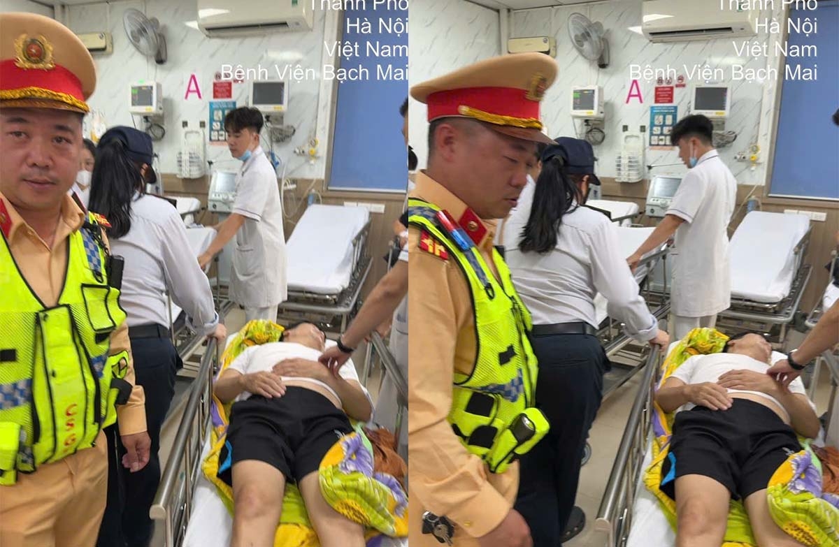 Cảnh sát giao thông đưa bệnh nhân vào Bệnh viện Bạch Mai cấp cứu.
