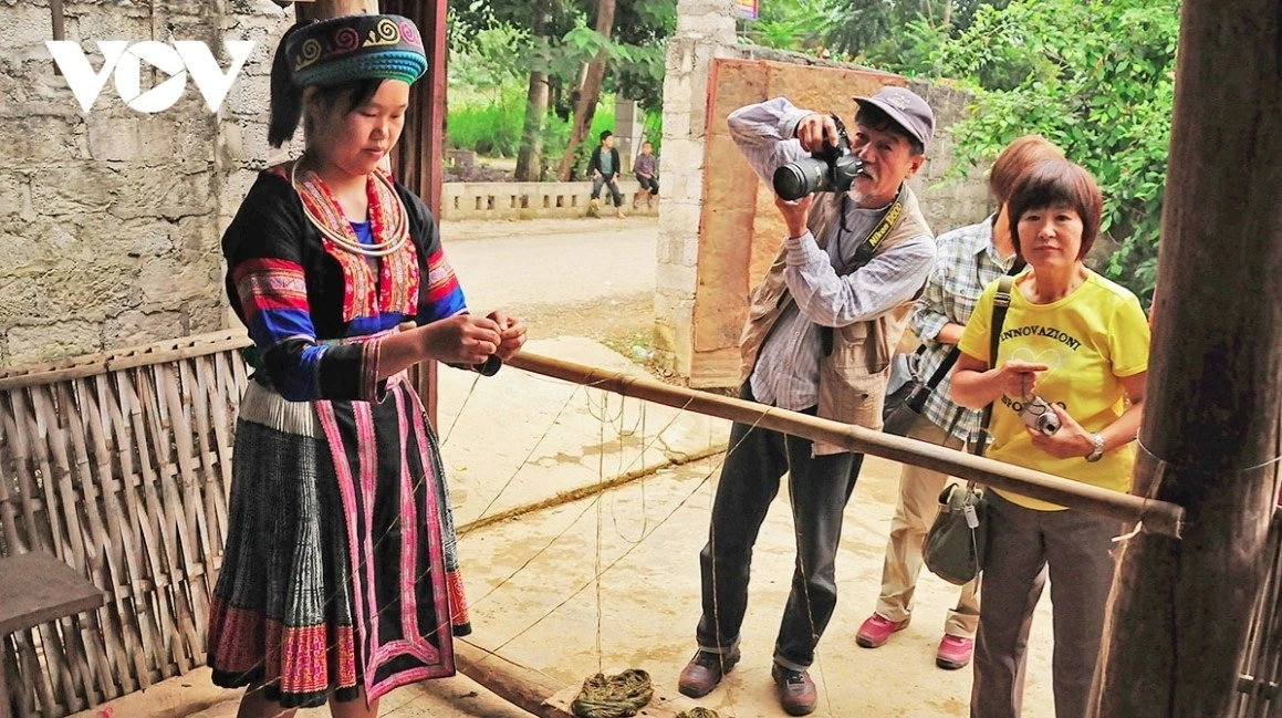 A Japanese tourist shares that he is very satisfied with the brocade products in the village because all of them are handcrafted.
