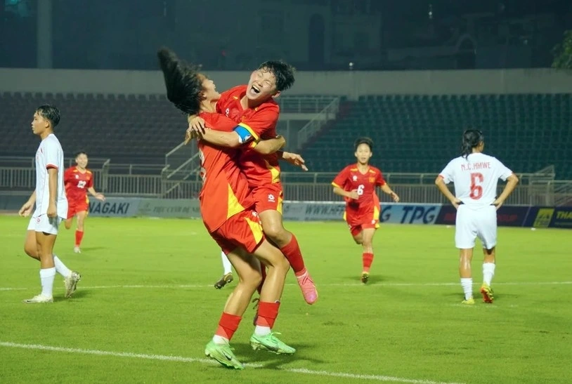 Vietnamese players celebrate a goal at the match against Myanmar on June 9