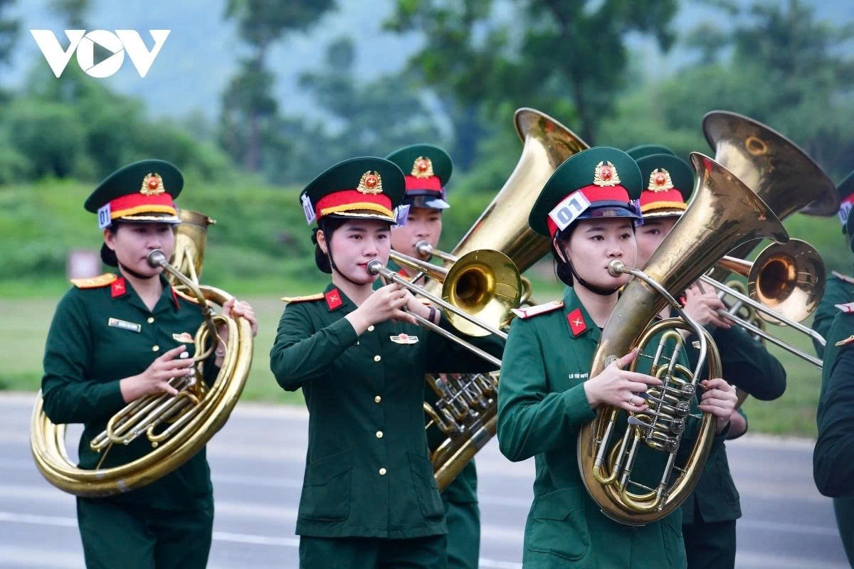 A contingent of female military band members takes part in the rehearsal, contributing to the ceremonial atmosphere.