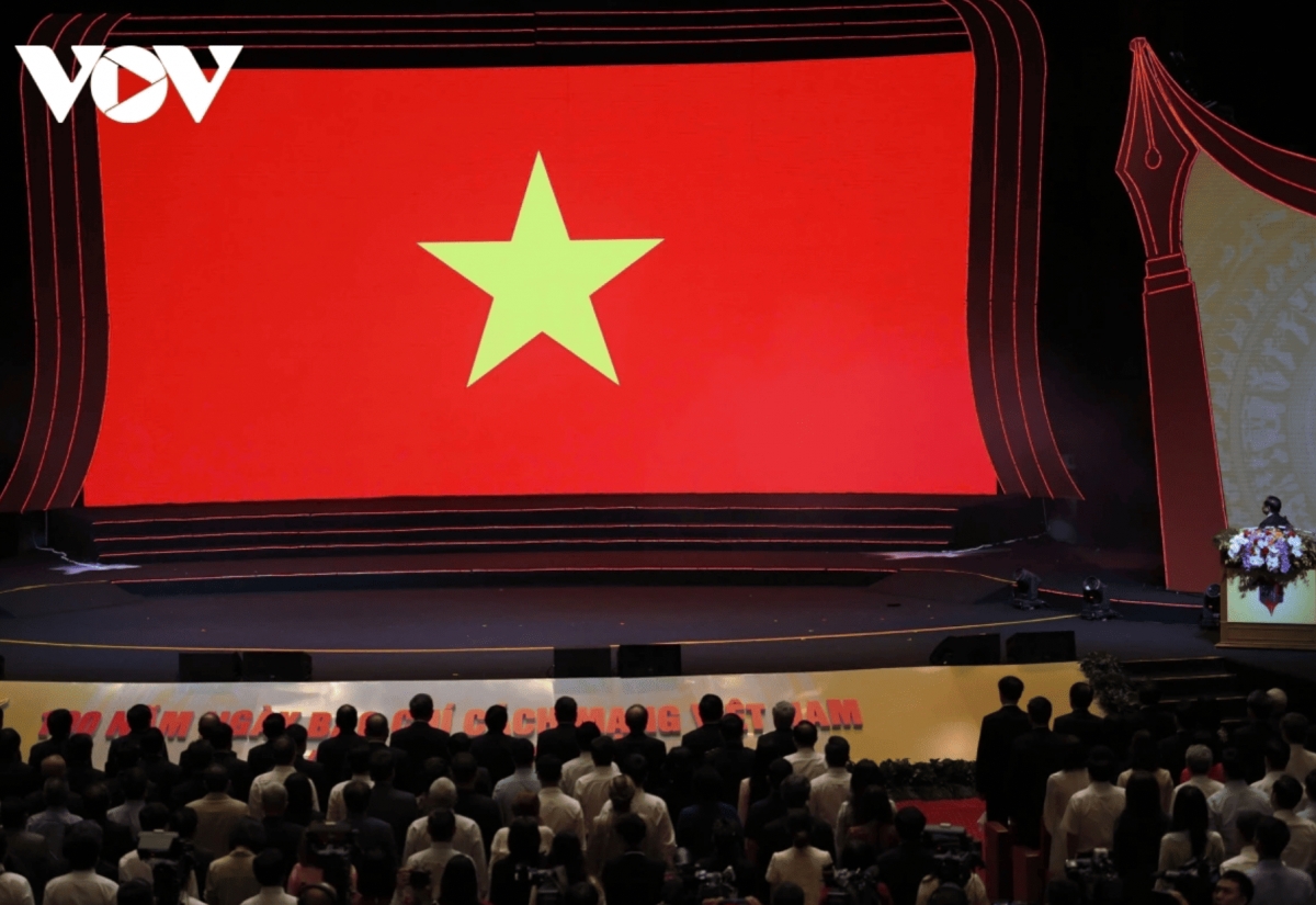Delegates come together to participate in a flag-raising ceremony as part of the occasion.