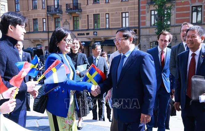 Thủ tướng Phạm Minh Chính thăm Đại học Kinh tế Stockholm. (Ảnh: Dương Giang/TTXVN)