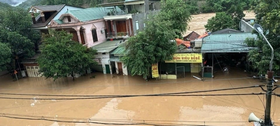 Rapidly rising river waters force many residents to abandon their homes and belongings as they evacuate themselves to safety.