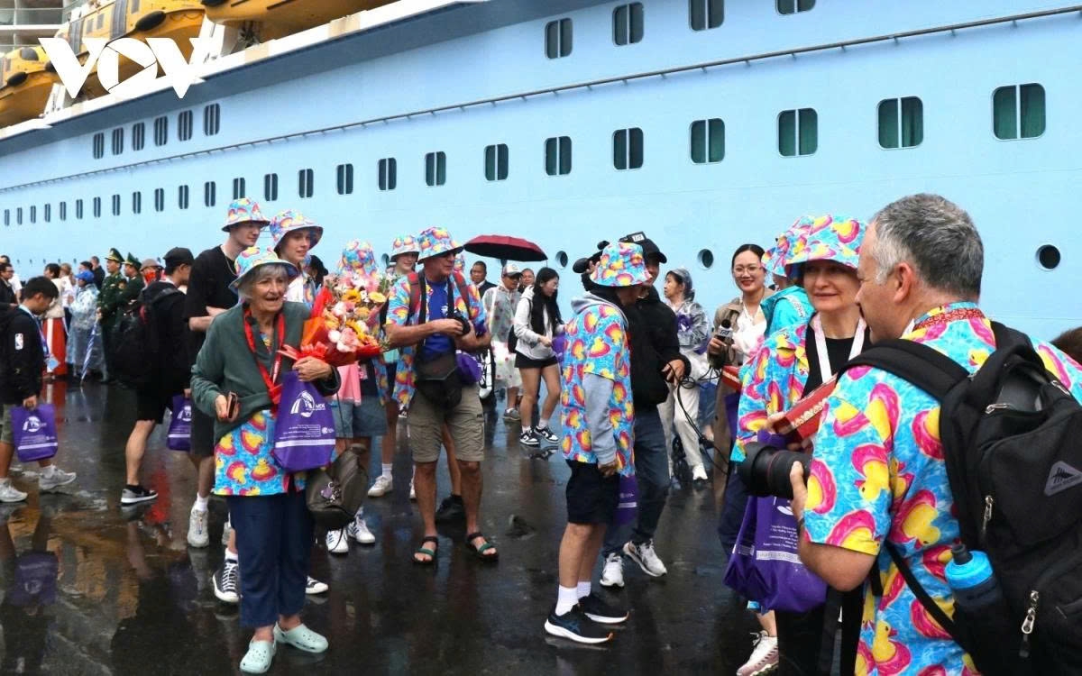 A luxury cruise ship brings foreign visitors to Hue, a famous tourist destination in central Vietnam