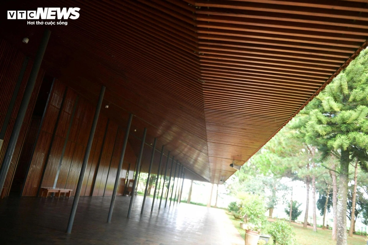 With a low, wide-spanning roof, the church appears to blend into the forest landscape, offering a warm, welcoming presence.