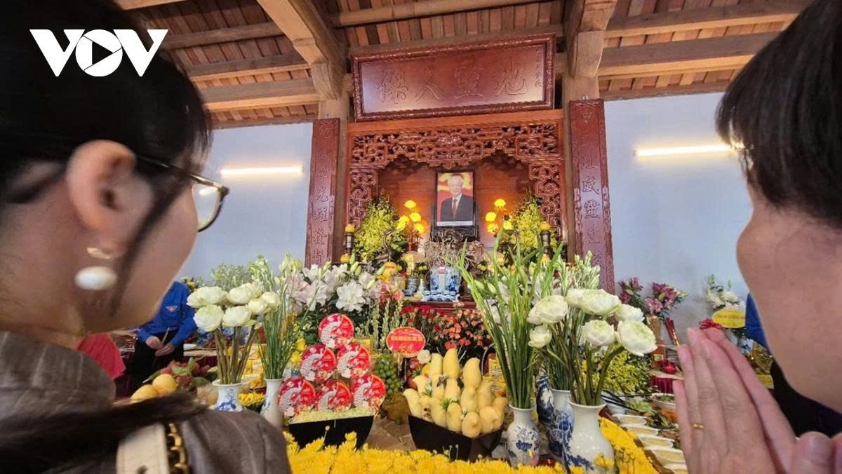 His portrait is placed on the worship altar adorned with lotus flowers symbolising purity and respect.