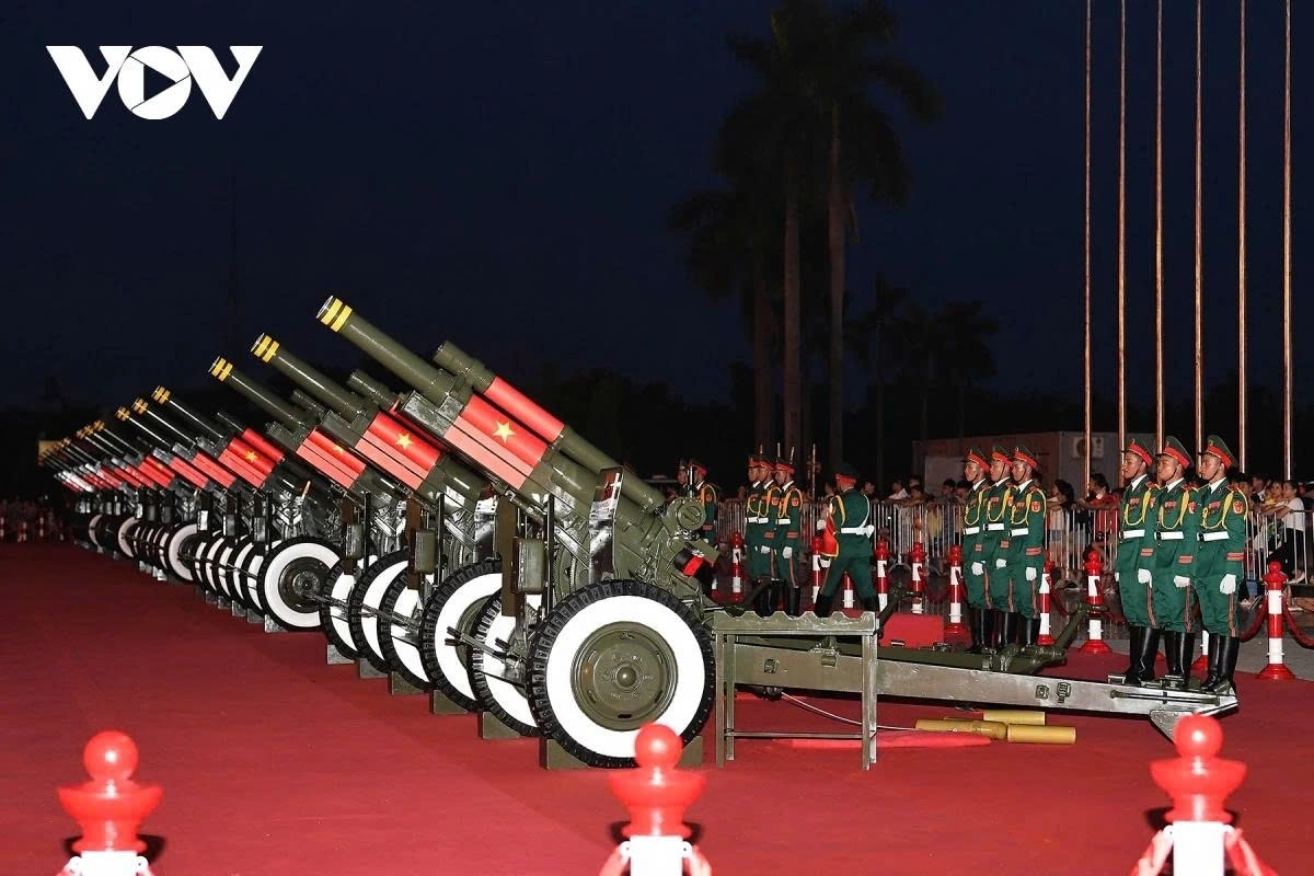The artillery pieces are arranged in a single row outside the stadium, divided into five platoons.