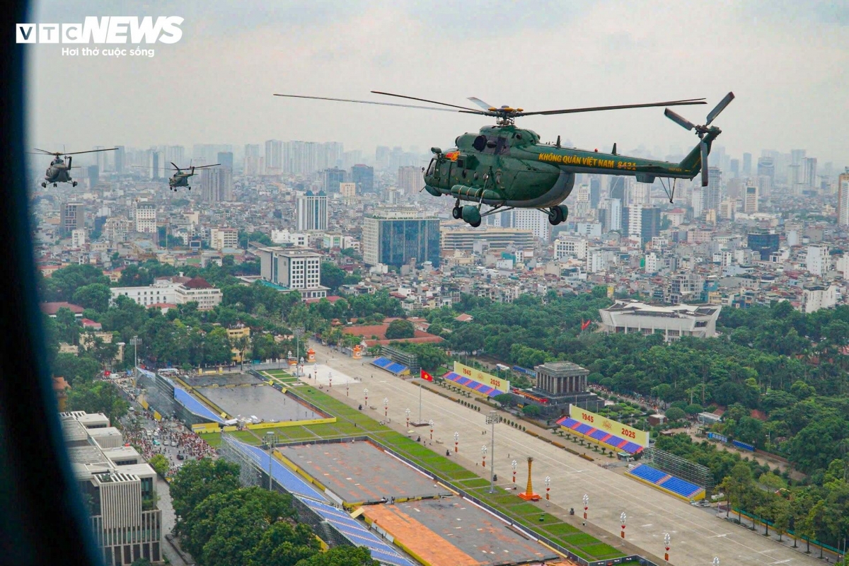   An aerial view captures Ba Dinh Square as helicopters perform flyover drills.