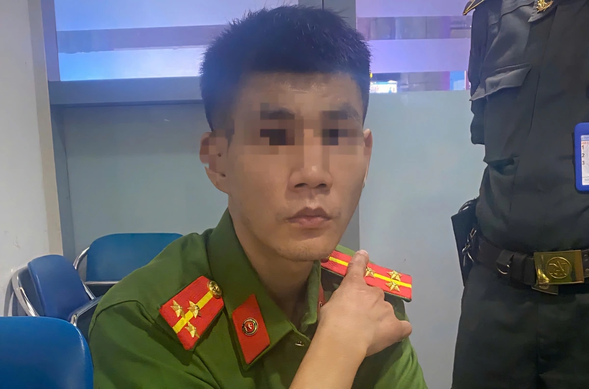 Đối tượng Trần Quang Huy tại cơ quan công an