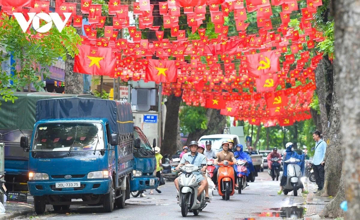 Red flags are put on display on Ly Nam De street.