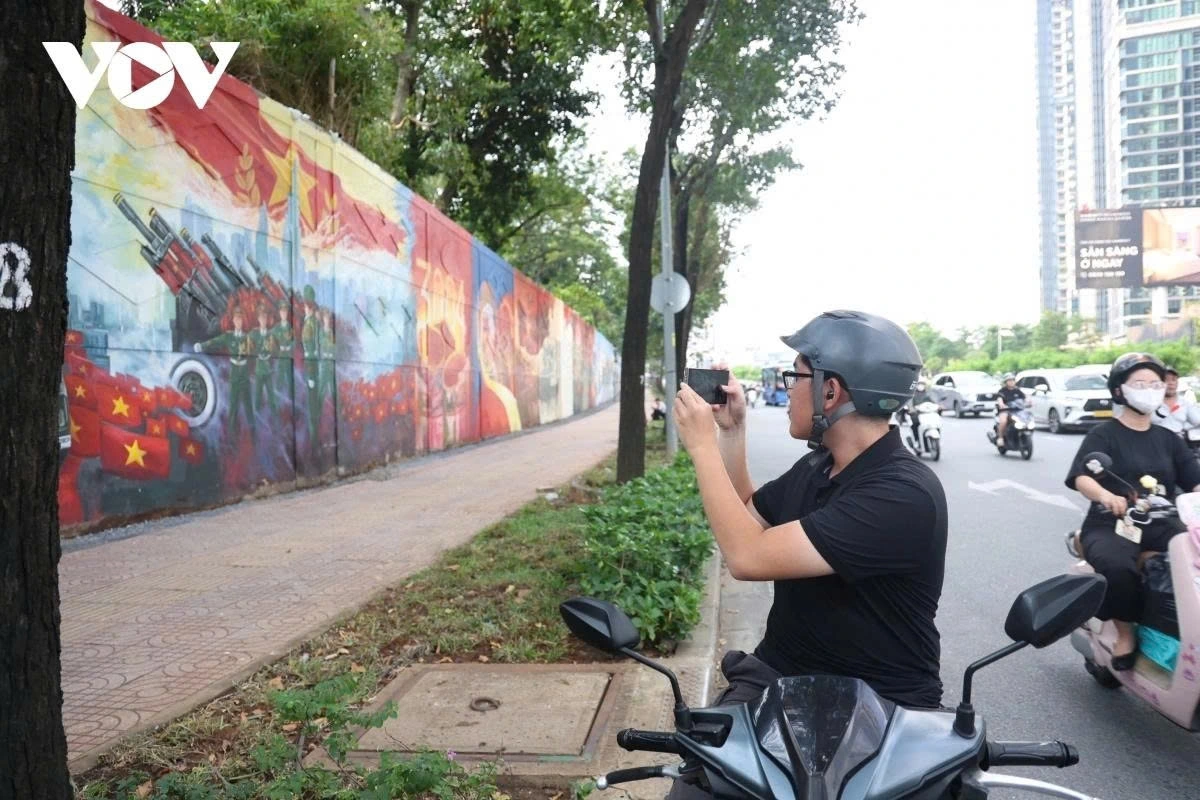 The giant mural painting depicts 36 units of military and police forces at the historic event celebrating the 50th anniversary of national reunification.