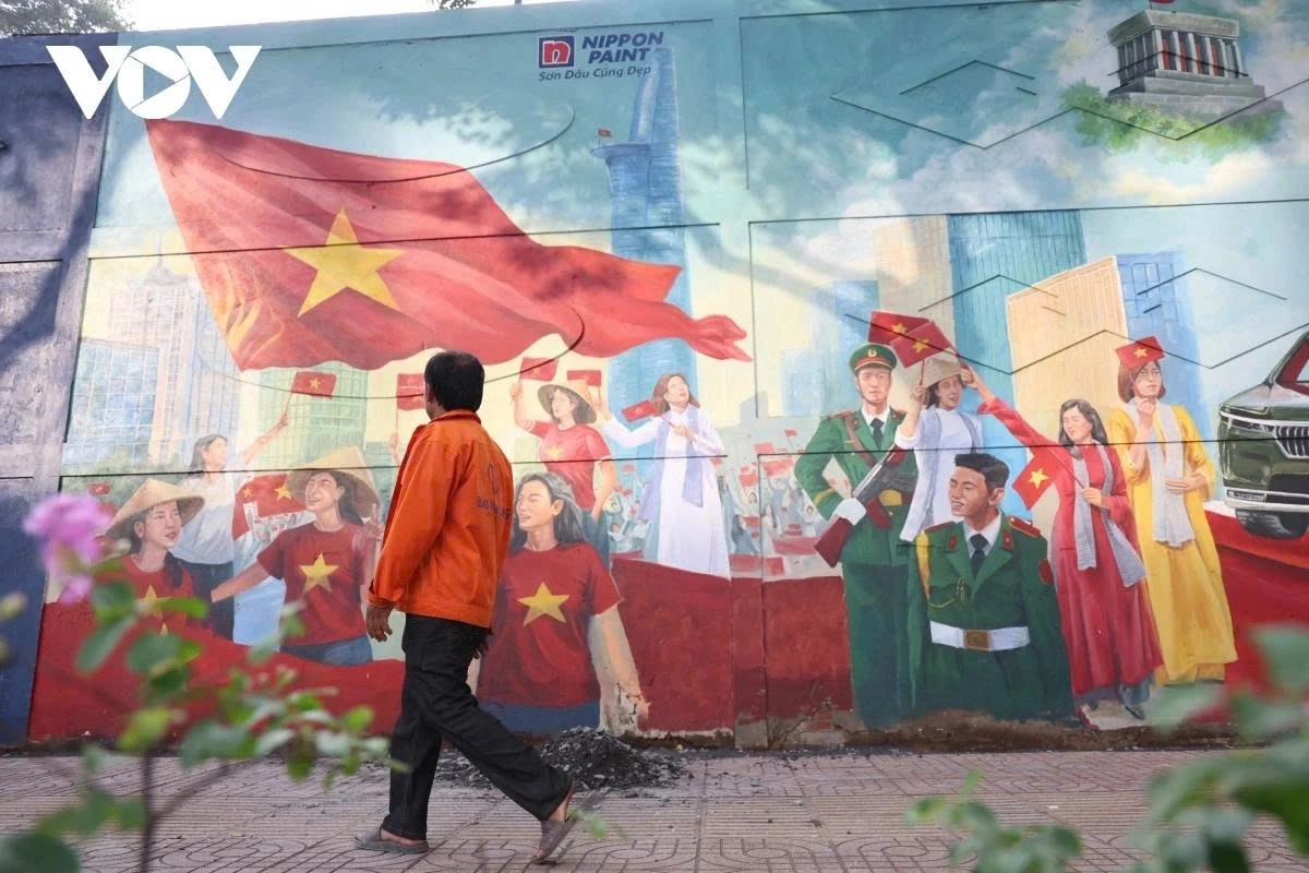 At the end of the painting, an image of veterans and armed forces walking among civilians symbolises the enduring values of peace and unity.