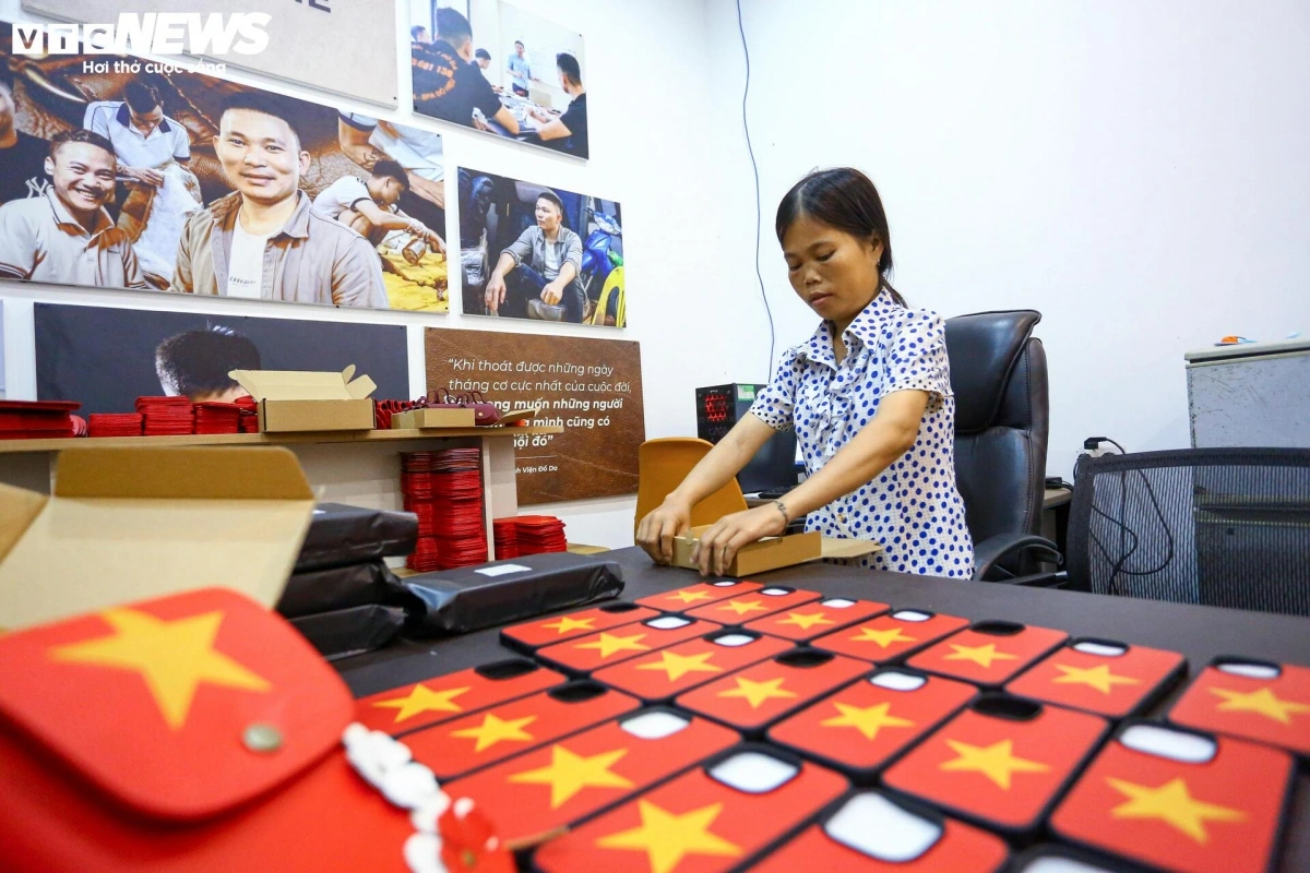 From their imperfect hands, they create items bearing the sacred image of the national flag.