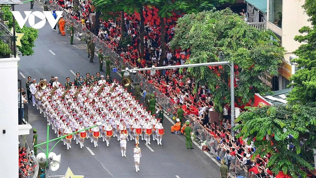 People gather along the main streets to watch the National Day parade rehearsal.