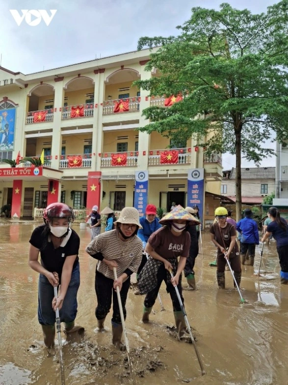 Teachers clean up Hong Thai Primary School in Lao Cai after flooding