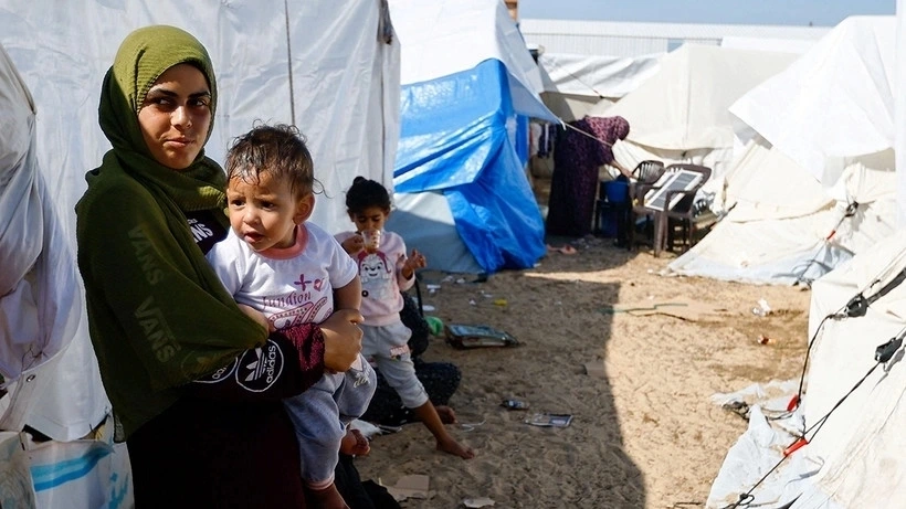 Người dân Palestine tại một trại tị nạn ở Dải Gaza. (Ảnh: Reuters)